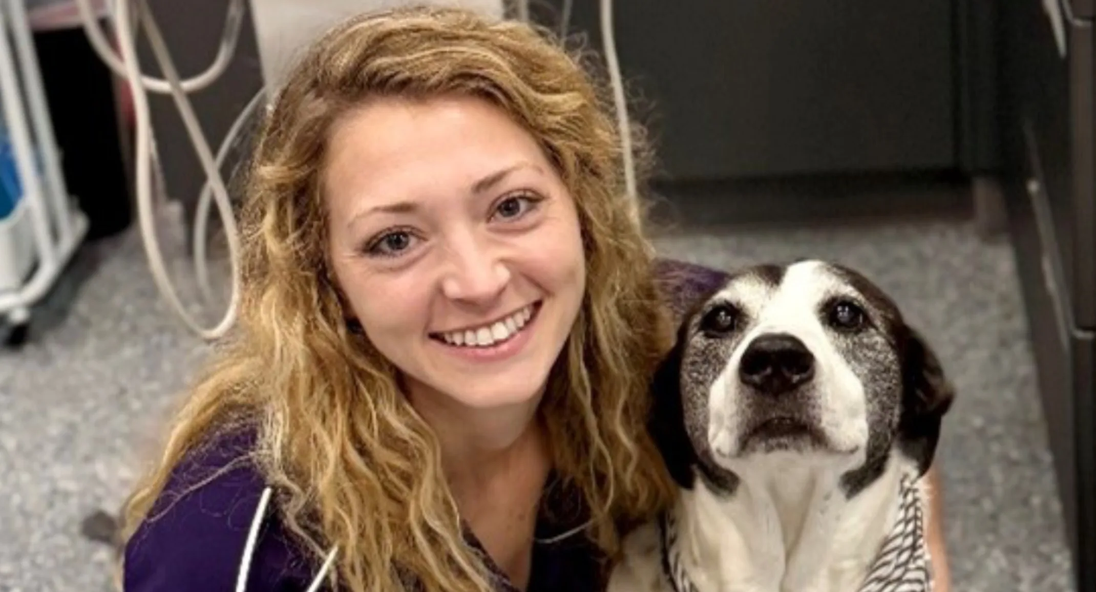 Courtney Hawthorne smiling with a dog. Courtney Hawthorne smiling with a dog.