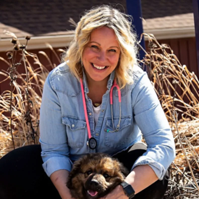Dr. Kate Gyselinck with brown dog Dr. Kate Gyselinck with brown dog