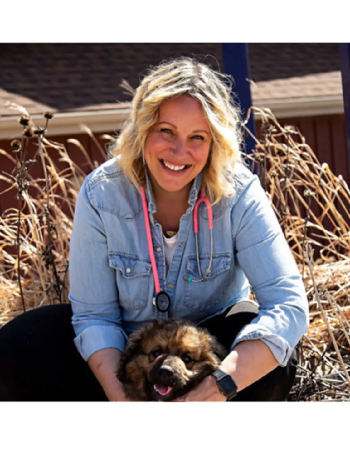 Dr. Kate Gyselinck with brown dog Dr. Kate Gyselinck with brown dog