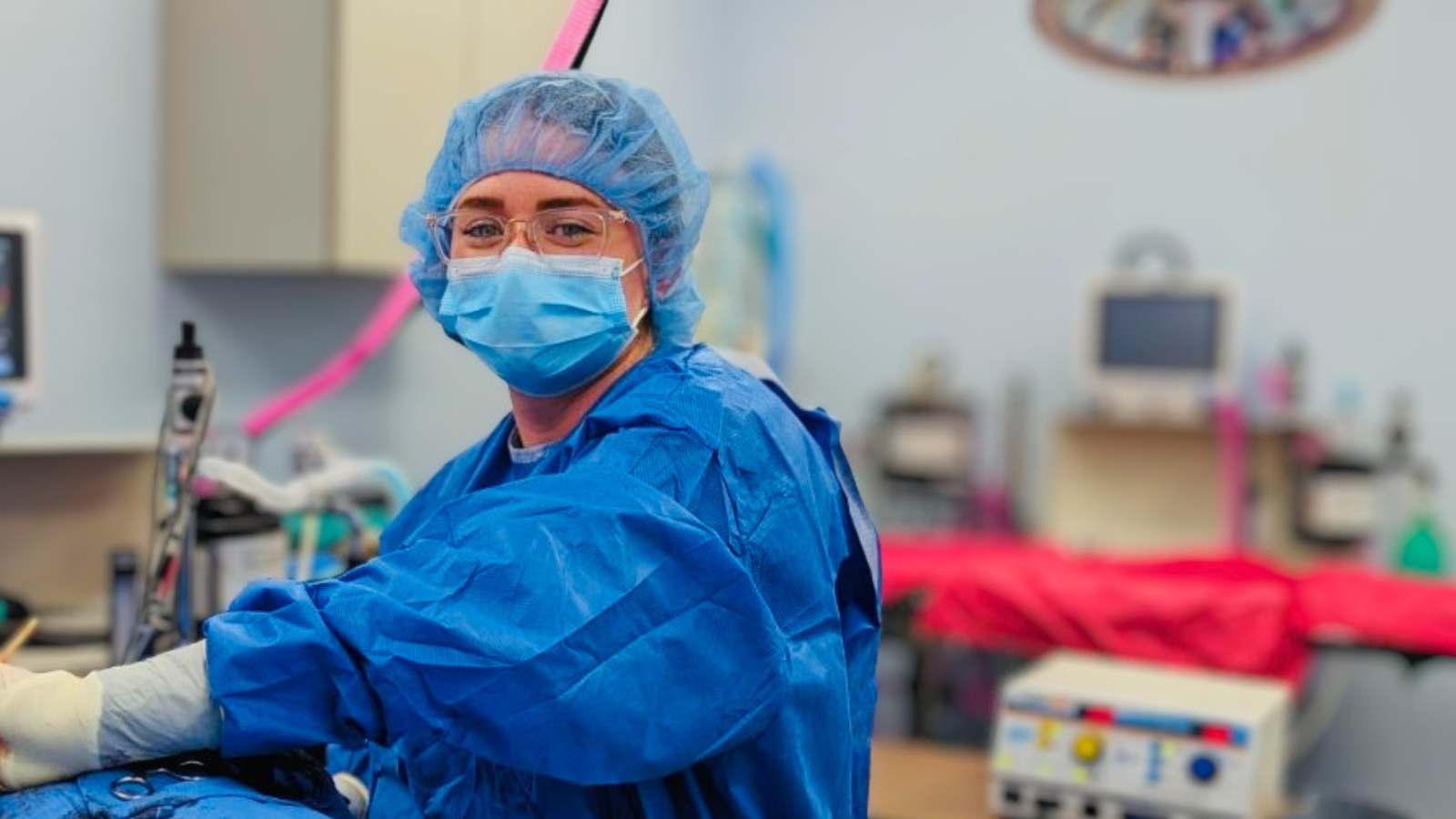 Dr. Cluck dressed in blue garb and a blue mask.