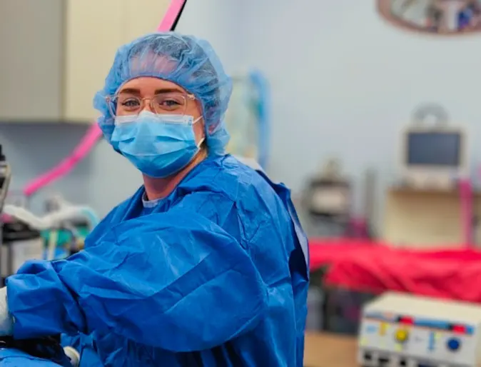 Dr. Cluck dressed in blue garb and a blue mask. Dr. Cluck dressed in blue garb and a blue mask.