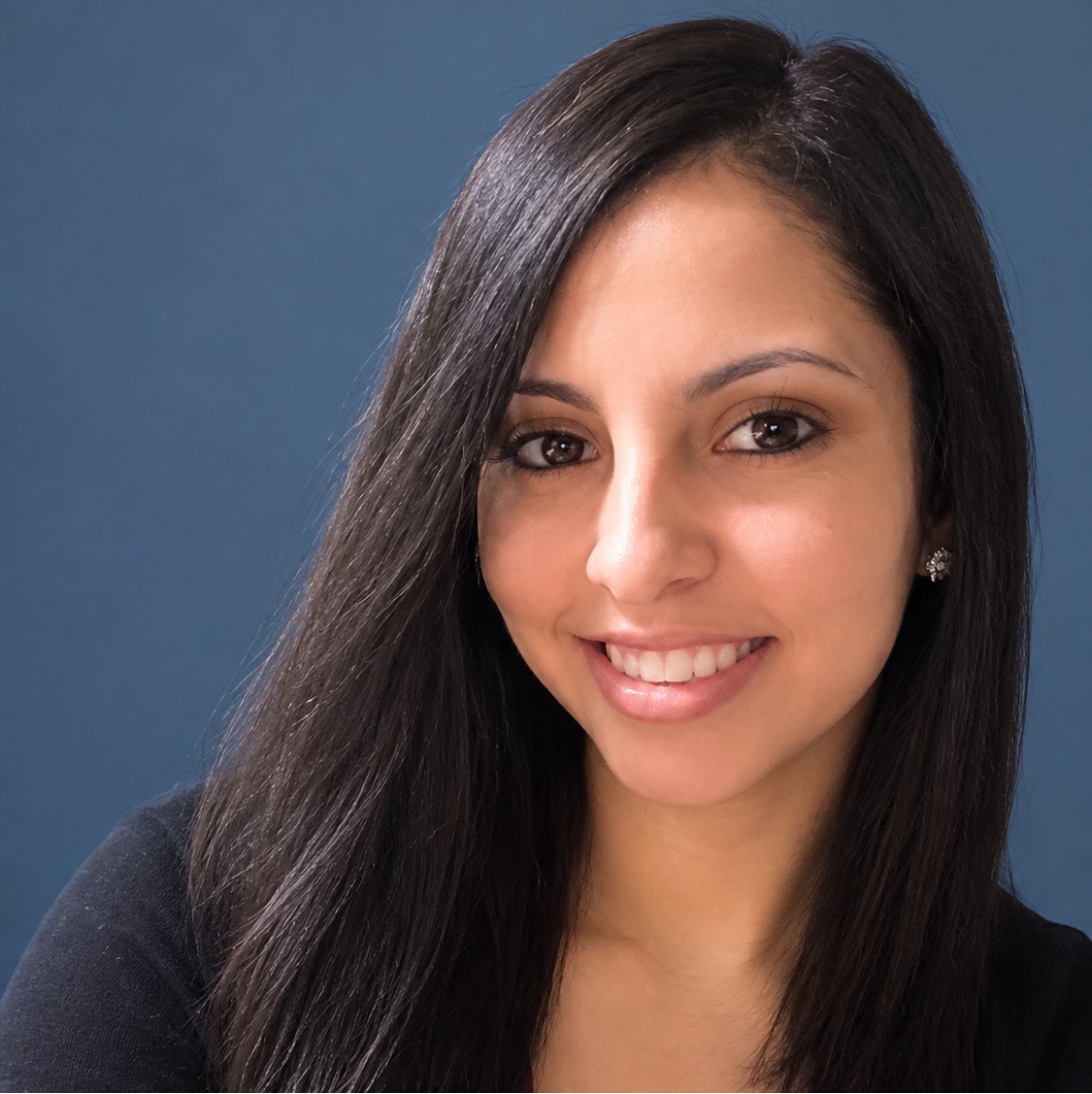 Ashley Hinojosa, Assistant Hospital Manager at North Channel Animal Hospital, holding a cat