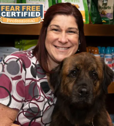 Kara with an arm around a dog Kara with an arm around a dog