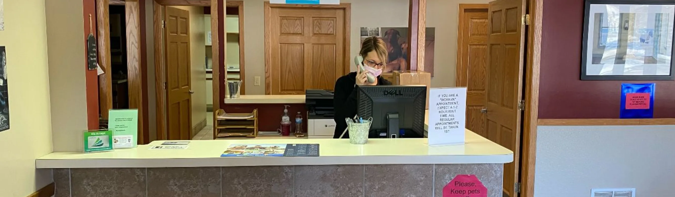 Reception staff in lobby of State Street Animal Clinic.