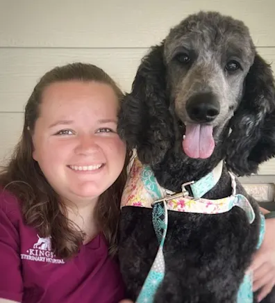 Mallory Smith with a black poodle Mallory Smith with a black poodle