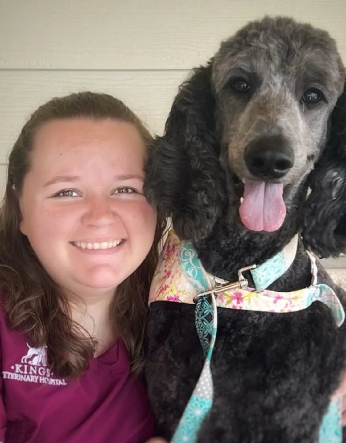 Mallory Smith with a black poodle Mallory Smith with a black poodle