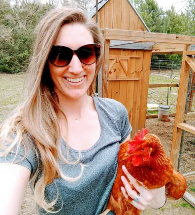Christy holding a chicken