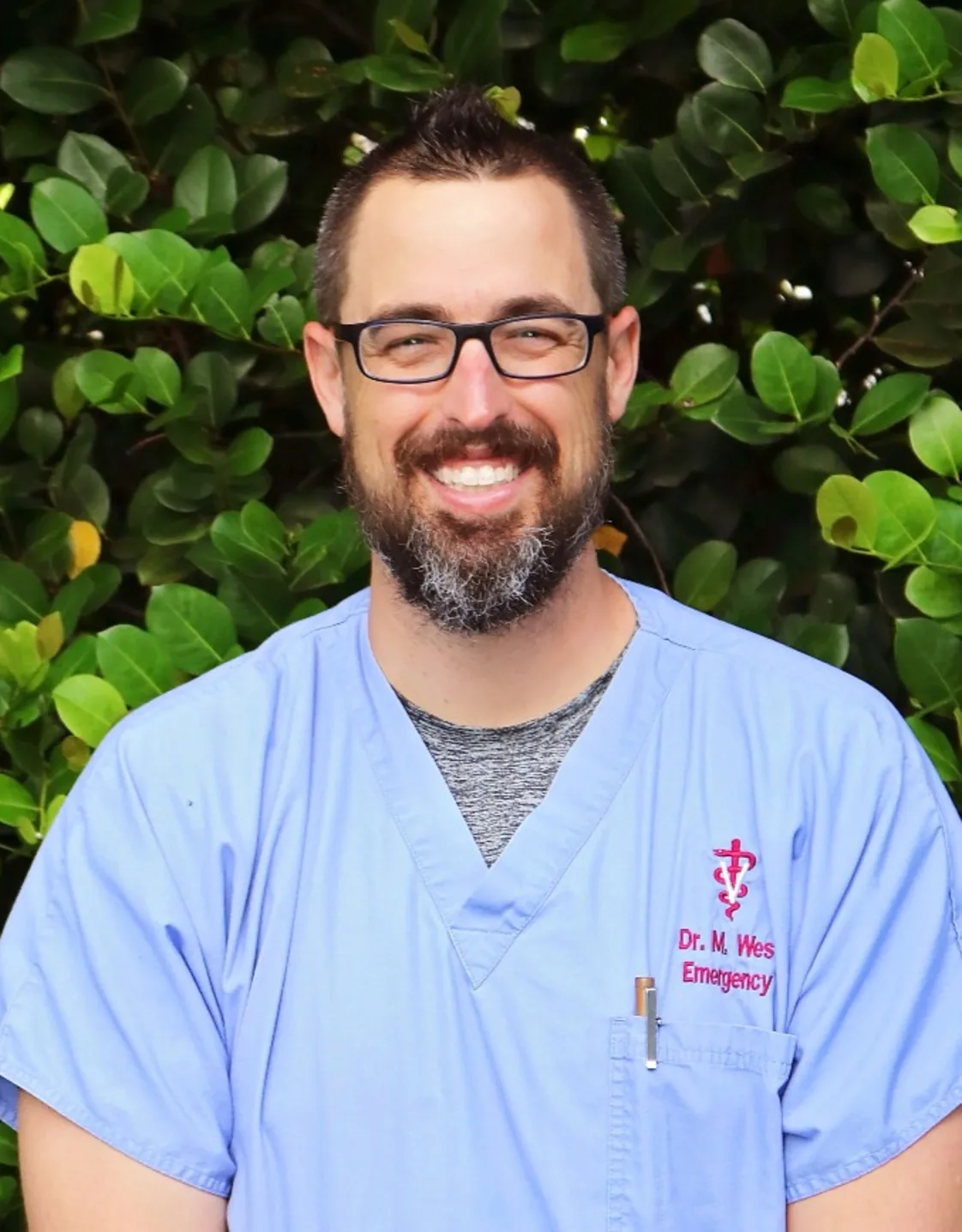 A puppy hiding on Dr. Michael West jacket A puppy hiding on Dr. Michael West jacket