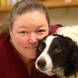 Sandy with small black and white dog