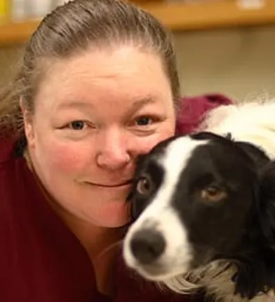 Sandy with small black and white dog Sandy with small black and white dog