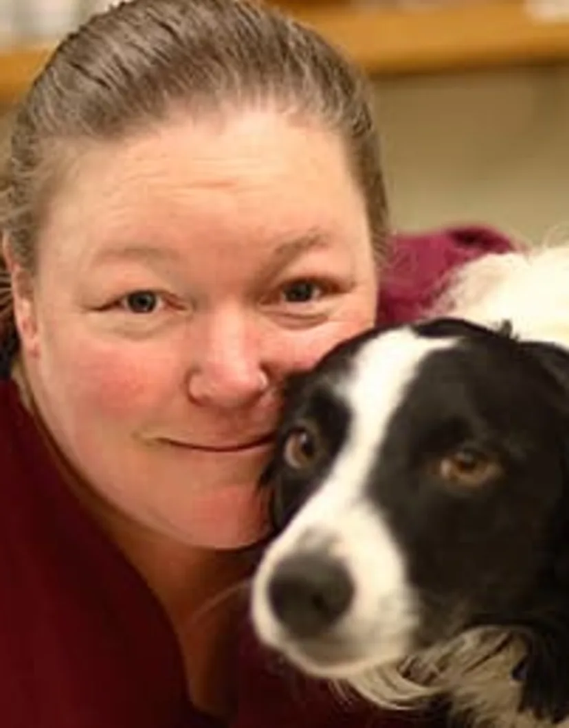 Sandy with small black and white dog