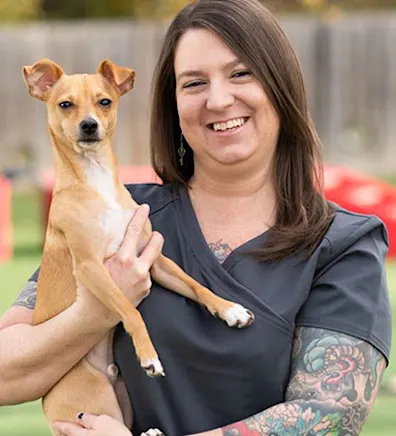 Joy holding tan and white dog Joy holding tan and white dog