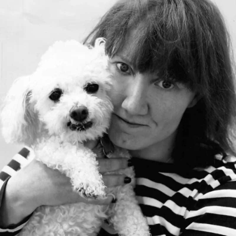 Staff photo of Heather posing with a dog. Staff photo of Heather posing with a dog.