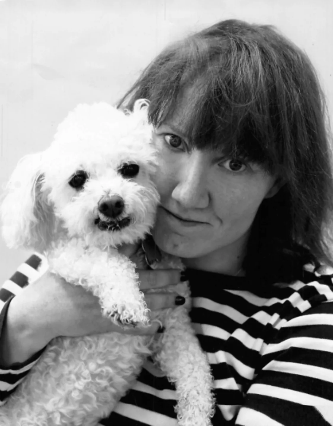 Staff photo of Heather posing with a dog. Staff photo of Heather posing with a dog.