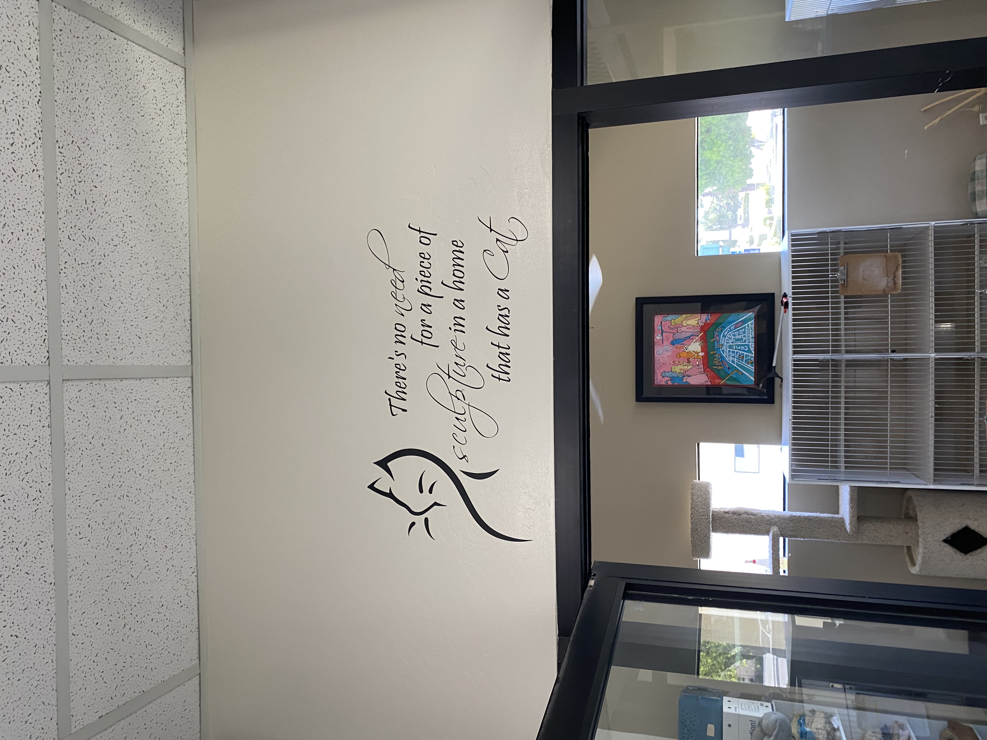 Cat quote decal reading "There's no need for a piece of sculpture in a home that has a cat".