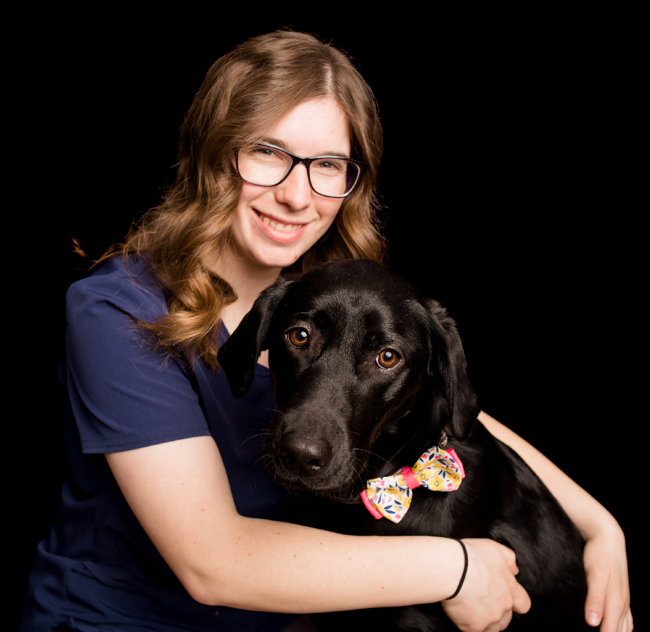 A Kindness Animal Hospital staff member with a dog