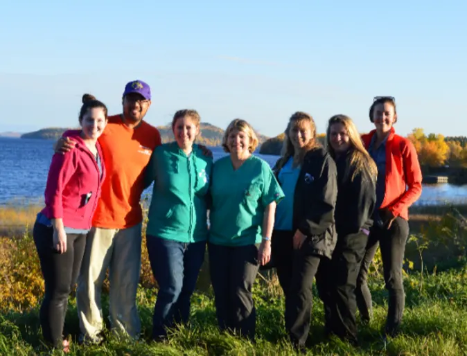 A group of Allandale's staff posing by sachigo lake A group of Allandale's staff posing by sachigo lake