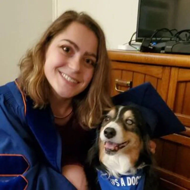 Dr. Kim Harlan with brown dog Dr. Kim Harlan with brown dog