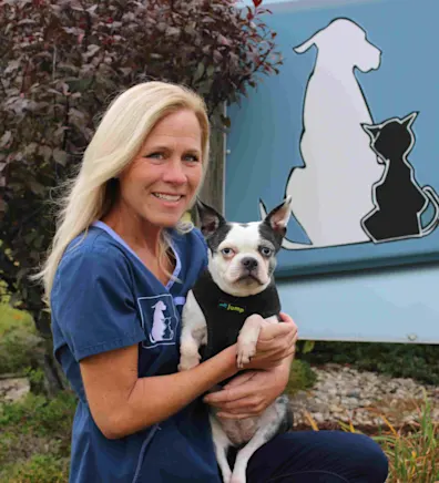 Sherri Howie holding a small dog Sherri Howie holding a small dog