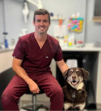 Dr. Daniel Martin and a dog Dr. Daniel Martin and a dog