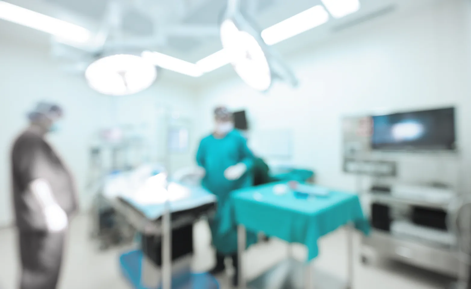 Blurry image of doctors standing in a surgery room