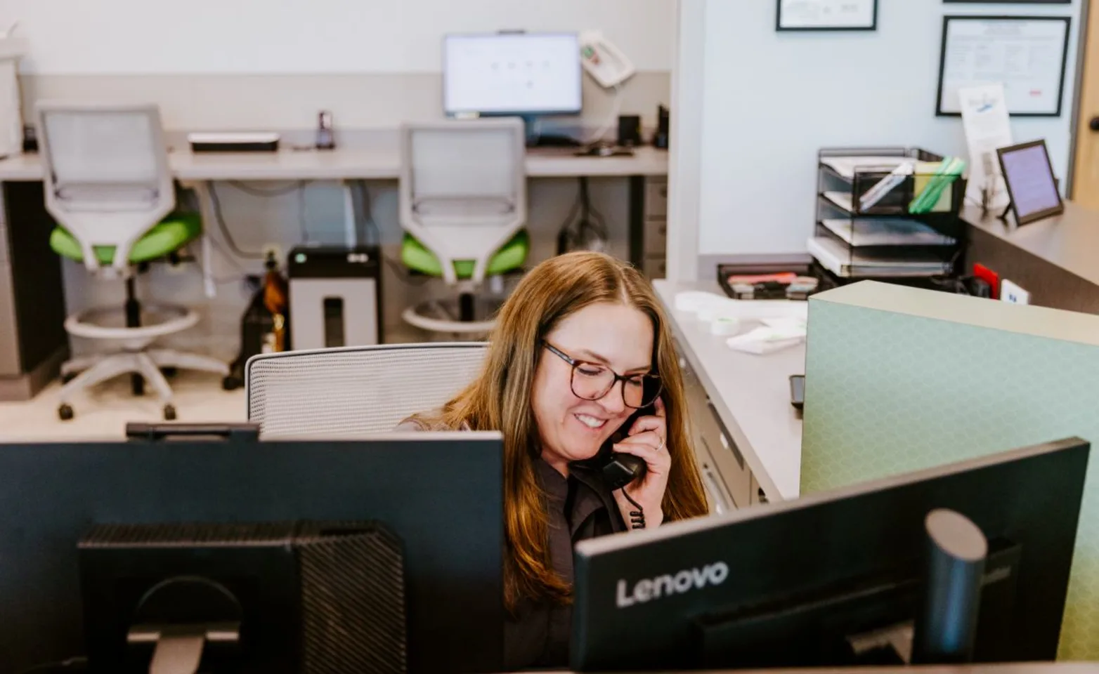 Receptionist on the phone Receptionist on the phone