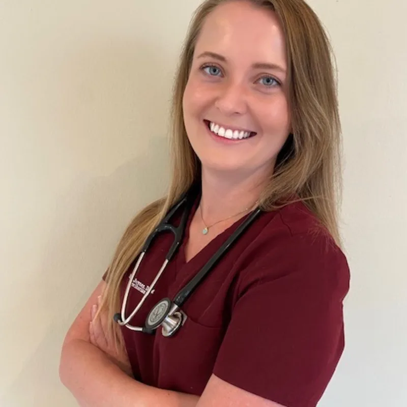 Dr. Kelsey Joyner in red scrubs. Dr. Kelsey Joyner in red scrubs.
