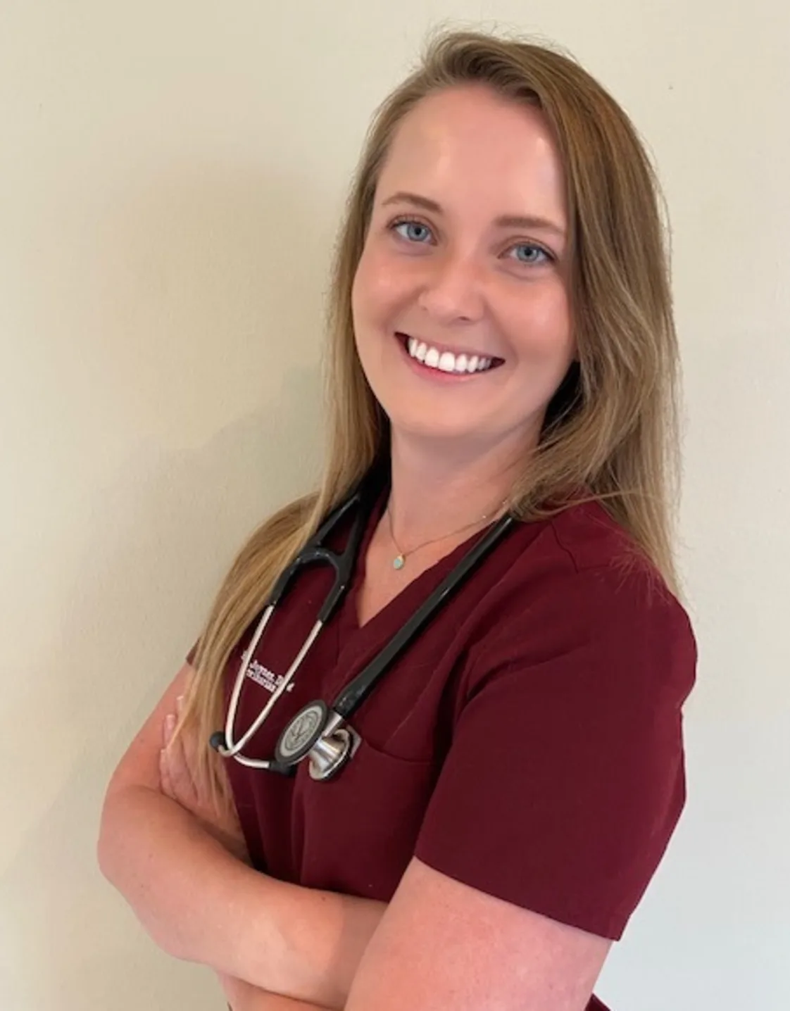 Dr. Kelsey Joyner in red scrubs. Dr. Kelsey Joyner in red scrubs.