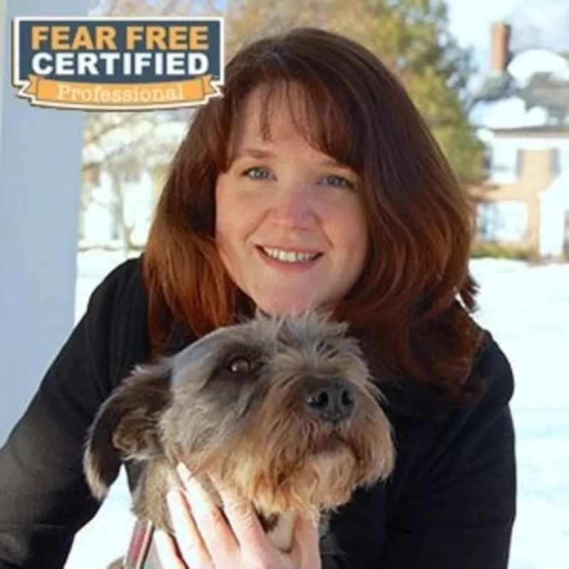 Dr. Elizabeth Sullivan holding a dog Dr. Elizabeth Sullivan holding a dog