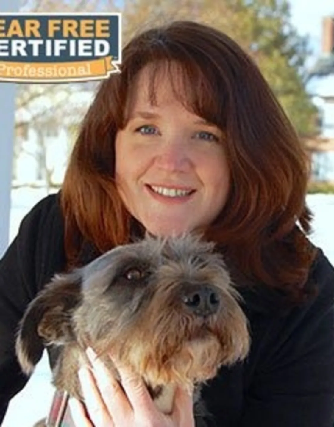 Dr. Elizabeth Sullivan holding a dog Dr. Elizabeth Sullivan holding a dog