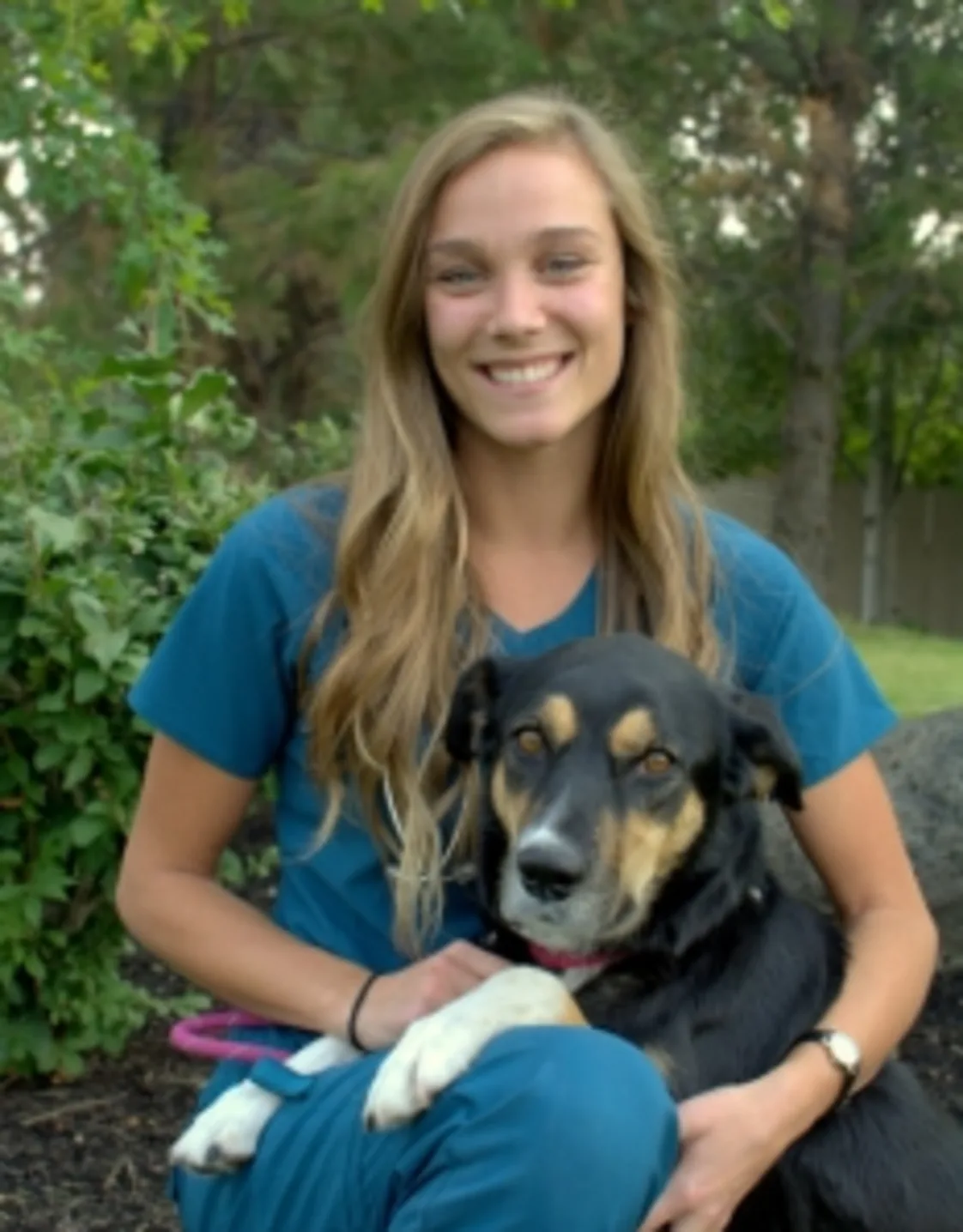 Jenna holding a dog outside Jenna holding a dog outside