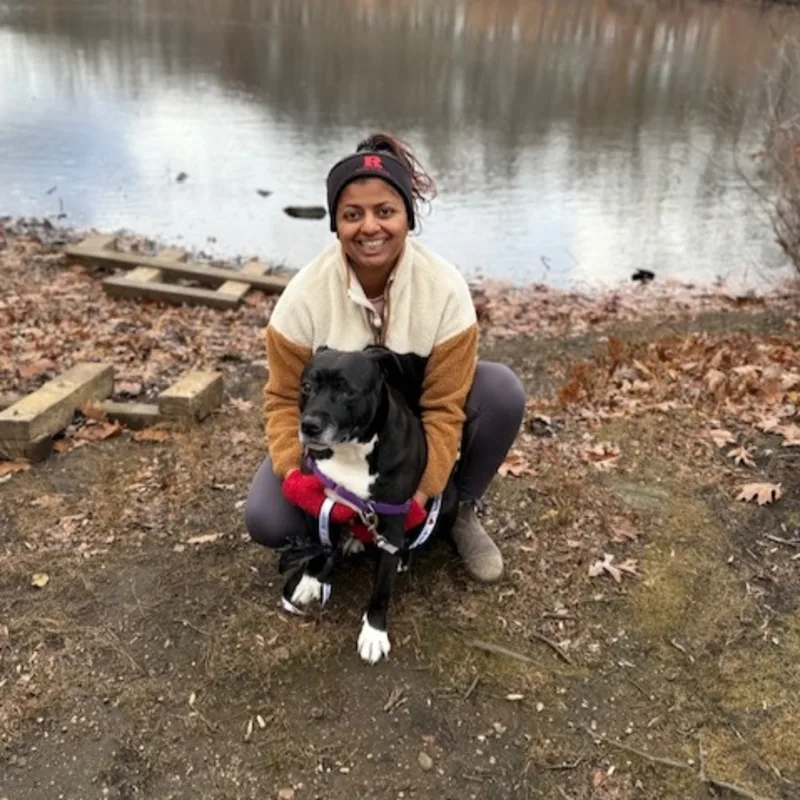 DVM Shruti Iyer sitting with a dog DVM Shruti Iyer sitting with a dog