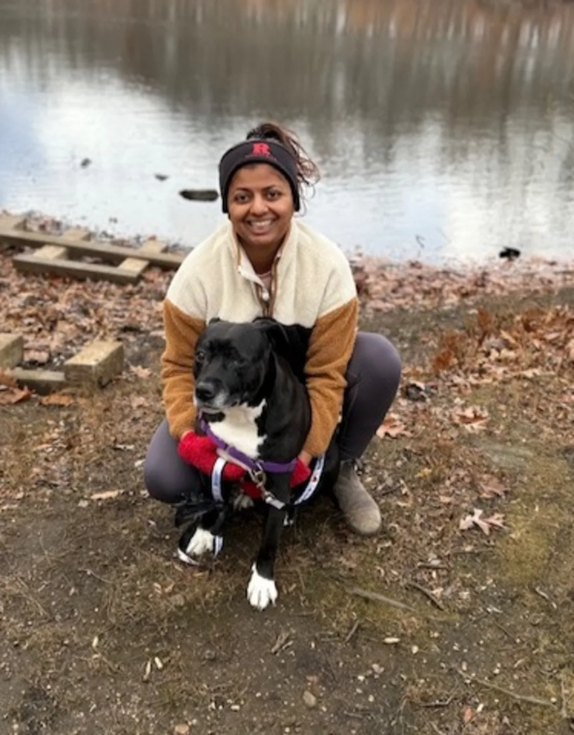 DVM Shruti Iyer sitting with a dog DVM Shruti Iyer sitting with a dog