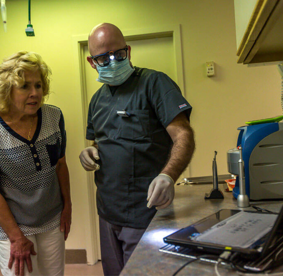 Veterinarian showing a pet parent an image