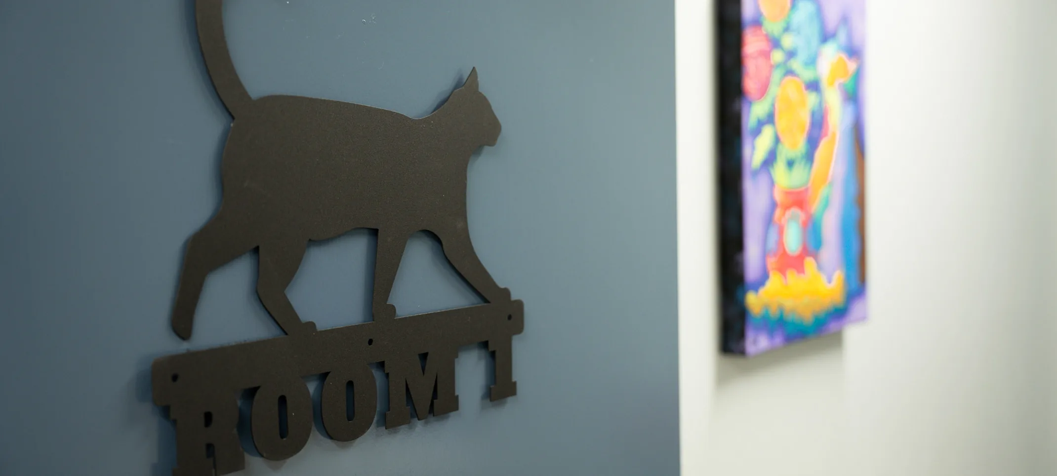 Room 1 with a cat sign Room 1 with a cat sign