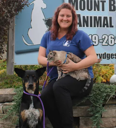 Cassandra holding her dog Cassandra holding her dog