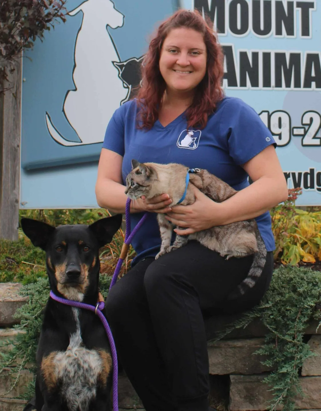 Cassandra holding her dog Cassandra holding her dog