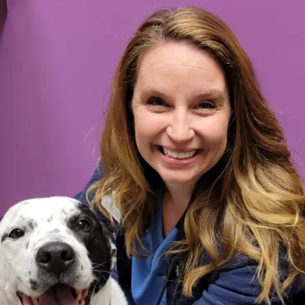 Dr. Shelly DeBoer with black and white dog