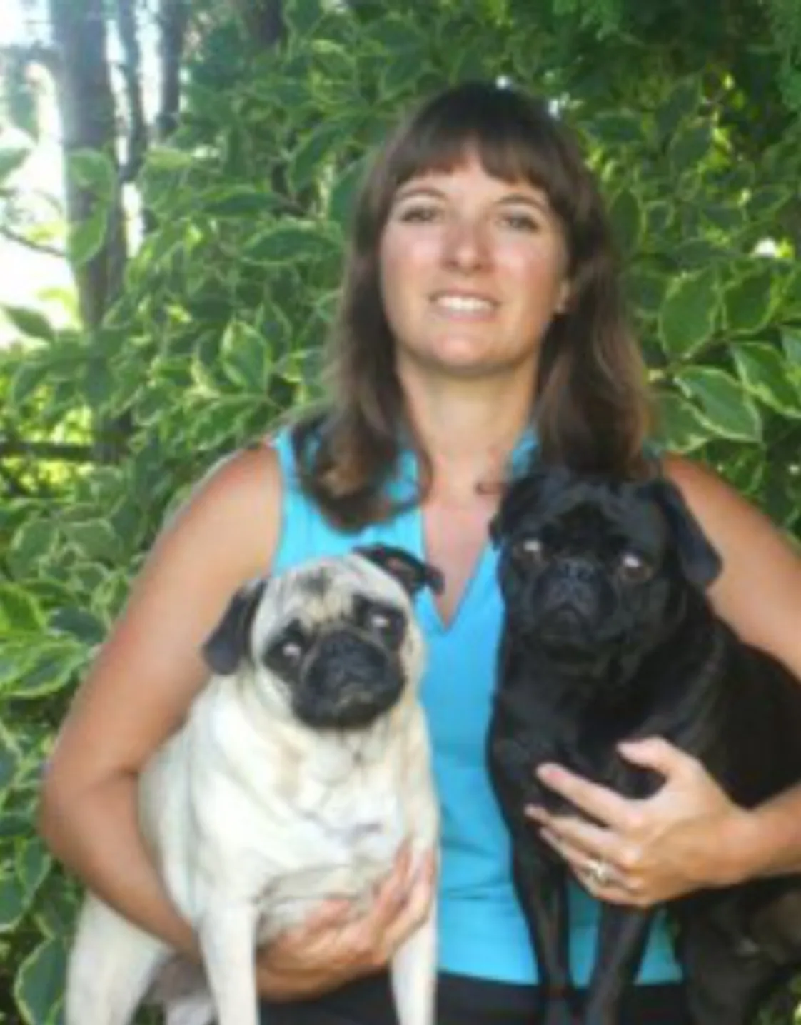 Jenn smiling with two dogs Jenn smiling with two dogs