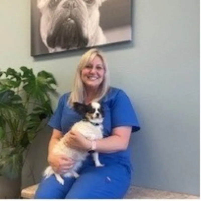 Jessica with black dog at Stonecrest Animal Hospital Jessica with black dog at Stonecrest Animal Hospital