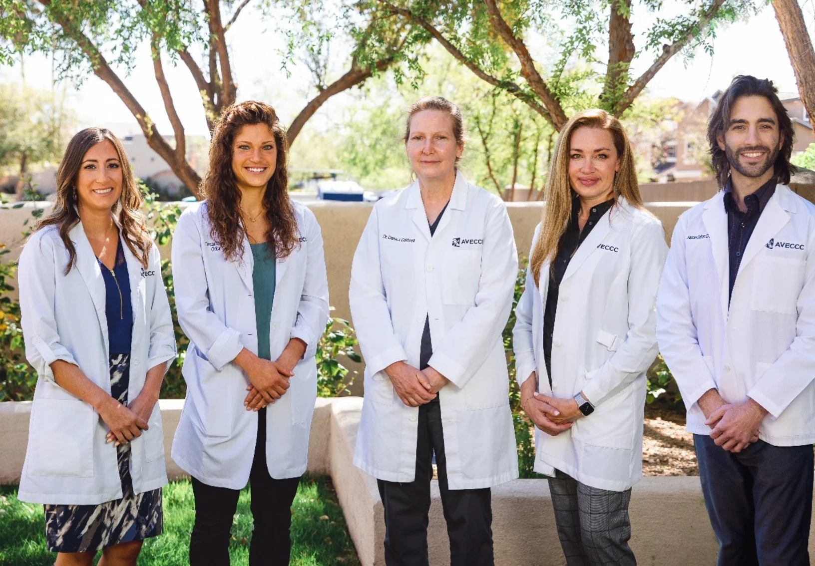 4 Arizona Veterinary Emergency & Critical Care Center staff members in white lab coats 