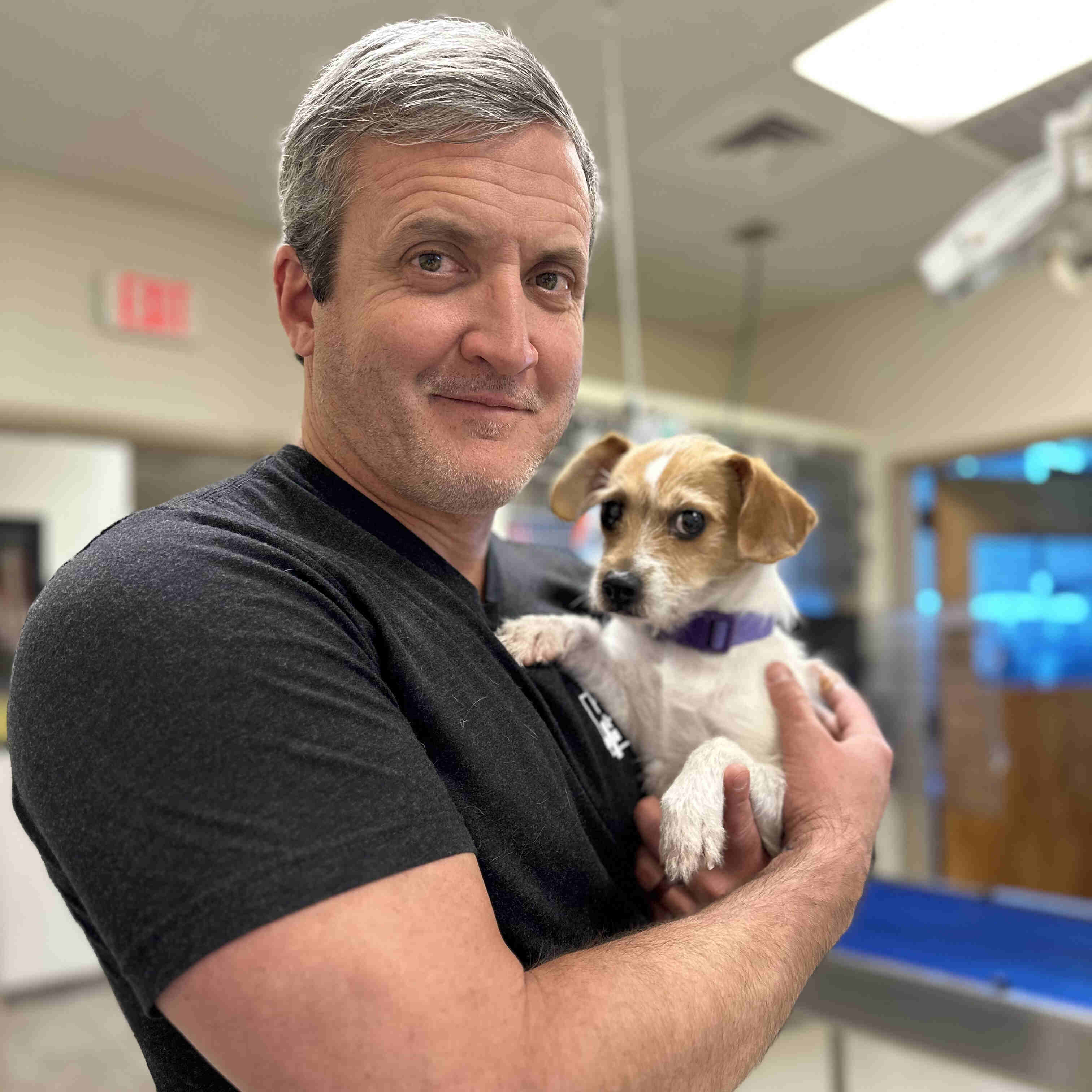  Dr. Mayfield Holding a Puppy