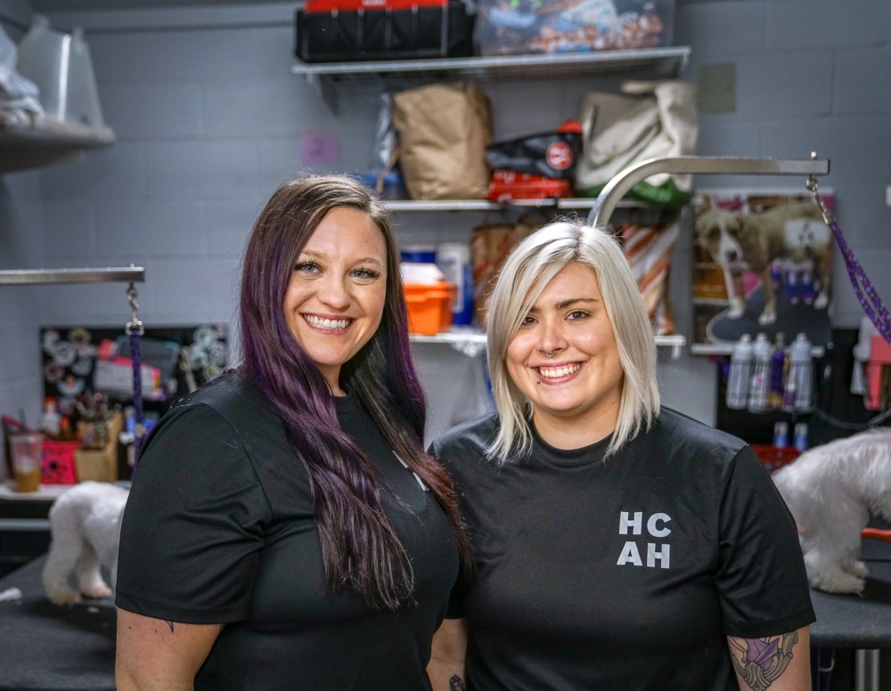 Two members of grooming staff at Hill Country Animal Hospital