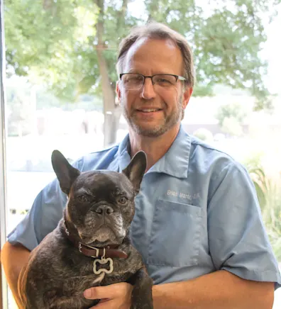 Brian Martz holding french bulldog Brian Martz holding french bulldog