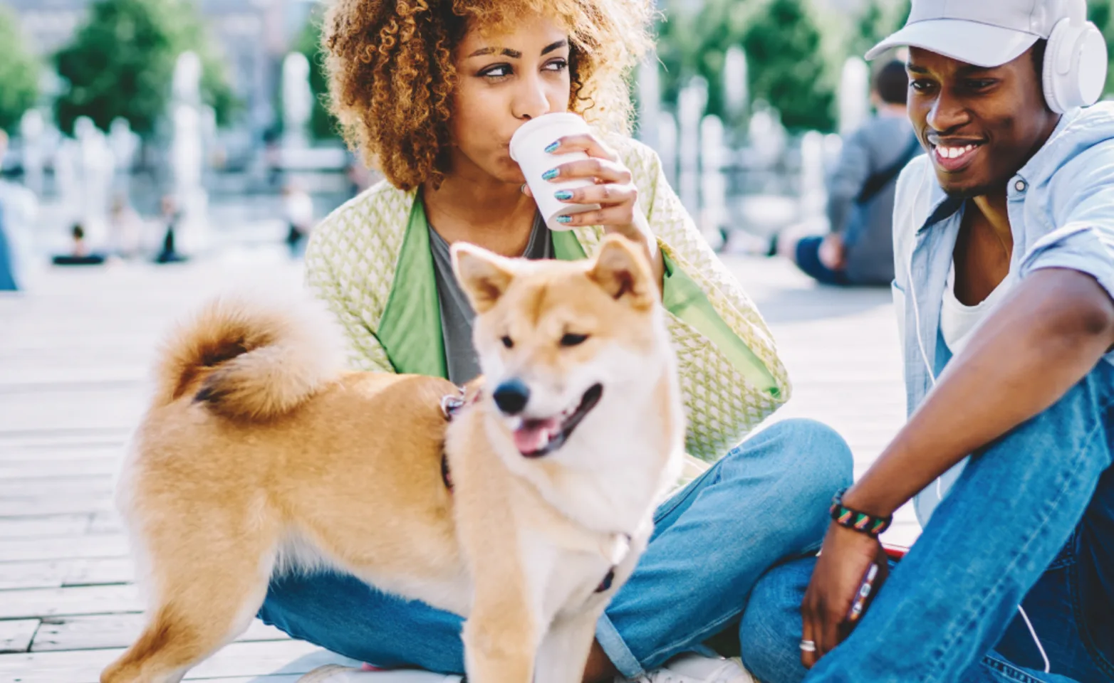 Couple sitting outside with their dog Couple sitting outside with their dog