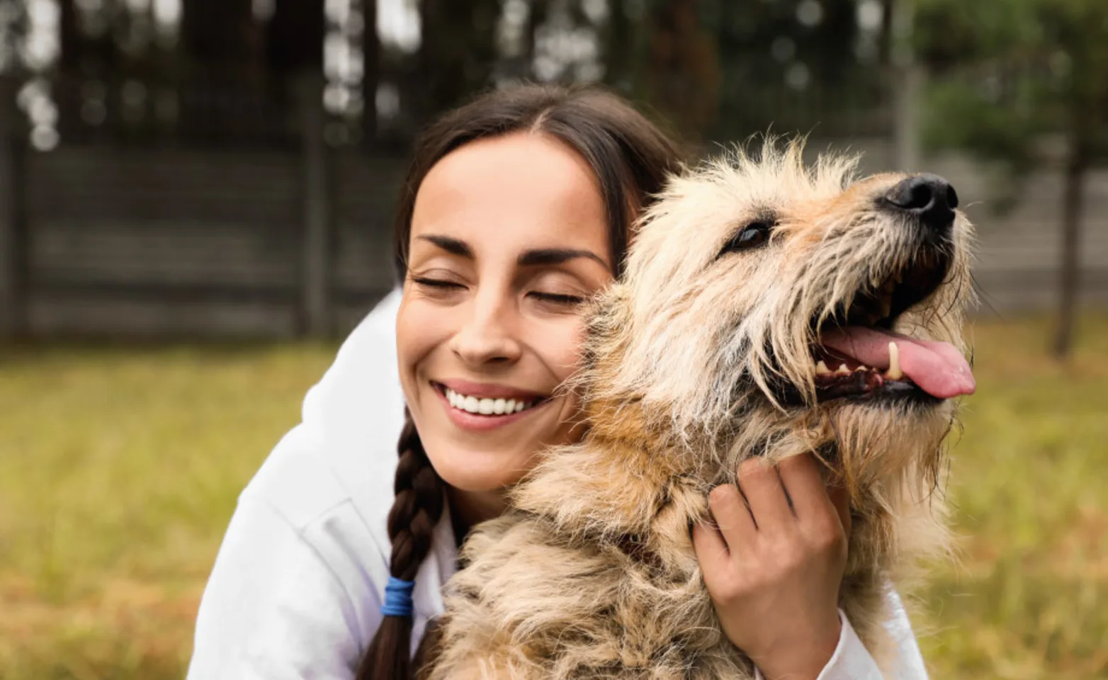 Woman hugging dog