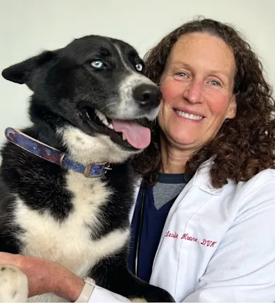 Dr. Leslie Moore with puppy at Clocktower Animal Hospital Dr. Leslie Moore with puppy at Clocktower Animal Hospital