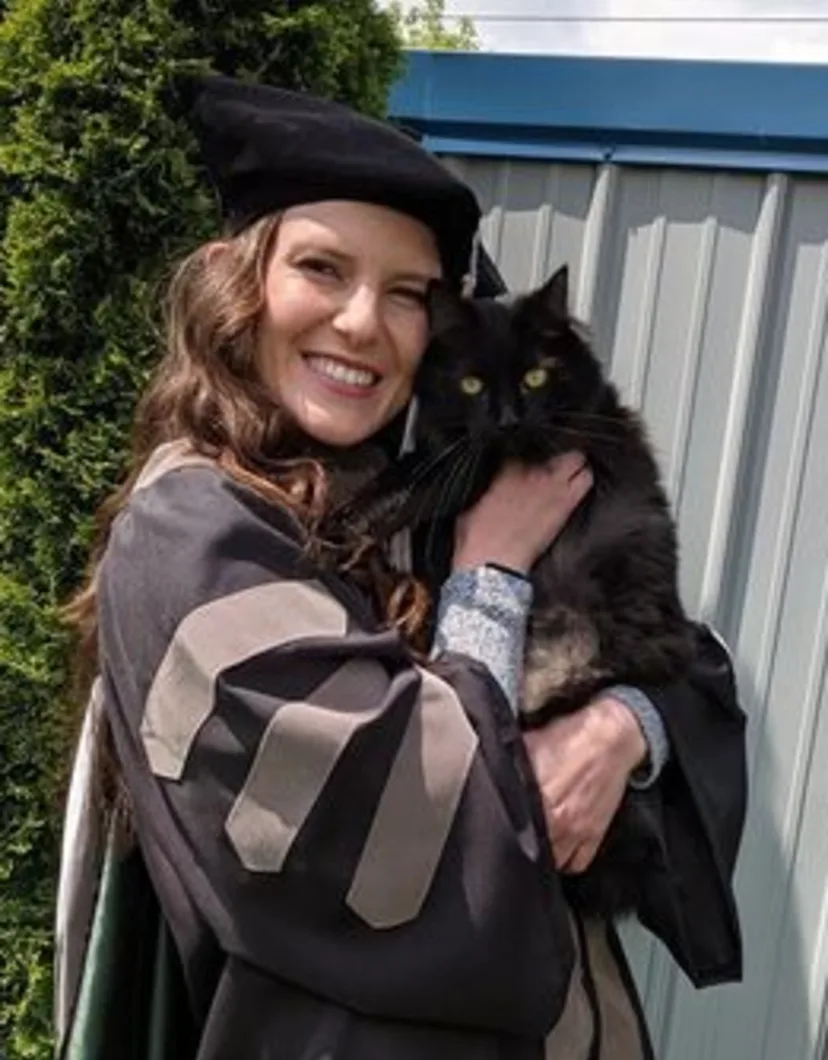 Photo of Elizabeth Durall and a black cat