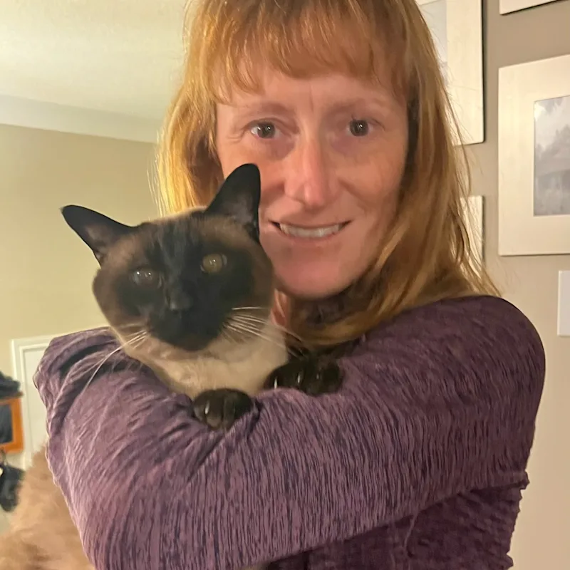 Dr. Nikolai Simkulak with trees in the background Dr. Nikolai Simkulak with trees in the background