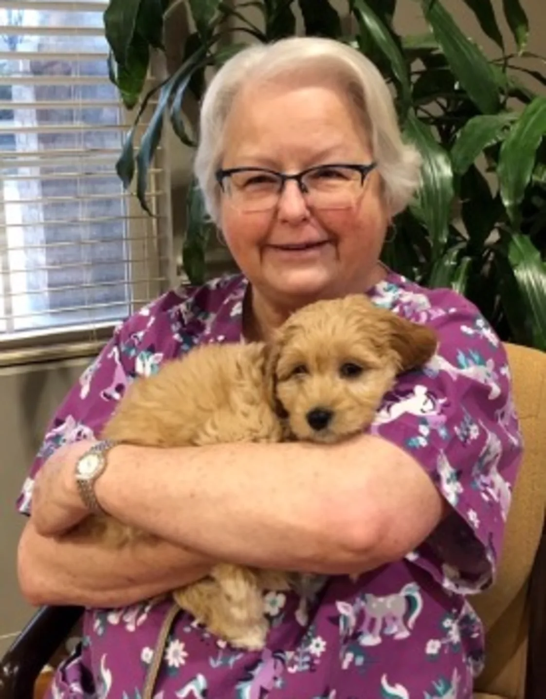 Brenda holding tan puppy Brenda holding tan puppy